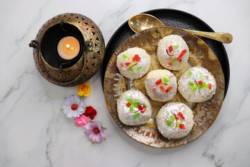 Rasmalai or Malai Sandwich, Roshmolai, Rasamalei is very popular Indian dessert. A sweet malai stuffing inside Rasgulla. It's a sweet delicacy made with Indian cottage cheese or chenna. Copy space.