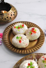 Rasmalai or Malai Sandwich, Roshmolai, Rasamalei is very popular Indian dessert. A sweet malai stuffing inside Rasgulla. It's a sweet delicacy made with Indian cottage cheese or chenna. Copy space.