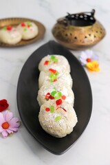 Rasmalai or Malai Sandwich, Roshmolai, Rasamalei is very popular Indian dessert. A sweet malai stuffing inside Rasgulla. It's a sweet delicacy made with Indian cottage cheese or chenna. Copy space.