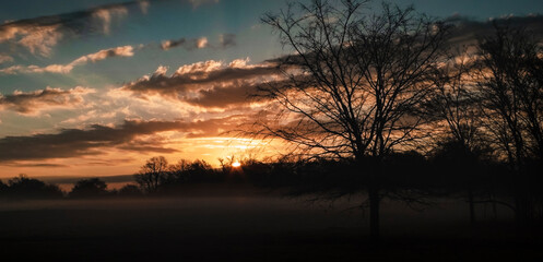Fototapeta na wymiar Winter sunrise with fog in the country