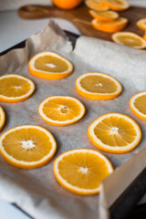 Oranges on a dish prepared for drying. Bright juicy orange slices. Fruit