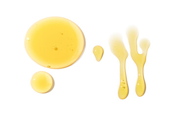 Set of honey drops. Dripping honey isolated on white background. Golden and flowing.
