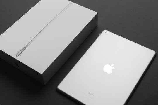 Minsk, Belarus- December 10, 2021: Apple Ipad 9 generation 10,2 inches 2021 with package box on black backdrop
