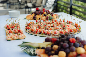 Rich many fresh fruits on luxury wedding table at the reception