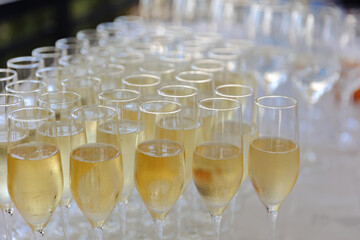 Lots of wine glasses during some festive event 