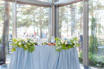 Fototapeta na wymiar Elegant table setup in blue pastels for a wedding