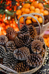 full basket pine cones christmas decoration tangerines