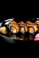 food sushi on the black plate