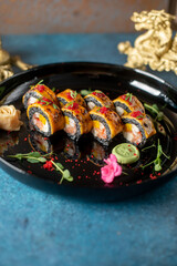 food sushi on the black plate