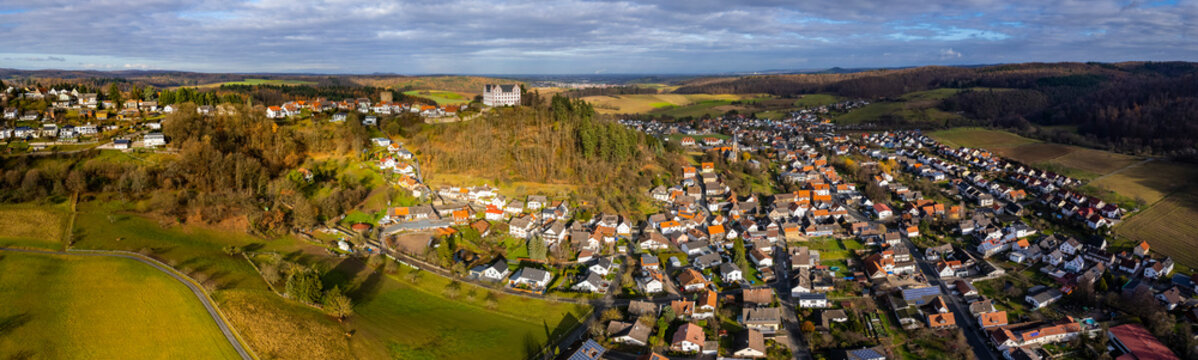  Aerial view around the city Niedernhausen, Fischbachtal in Germany. On a cloudy day in Autumn.  