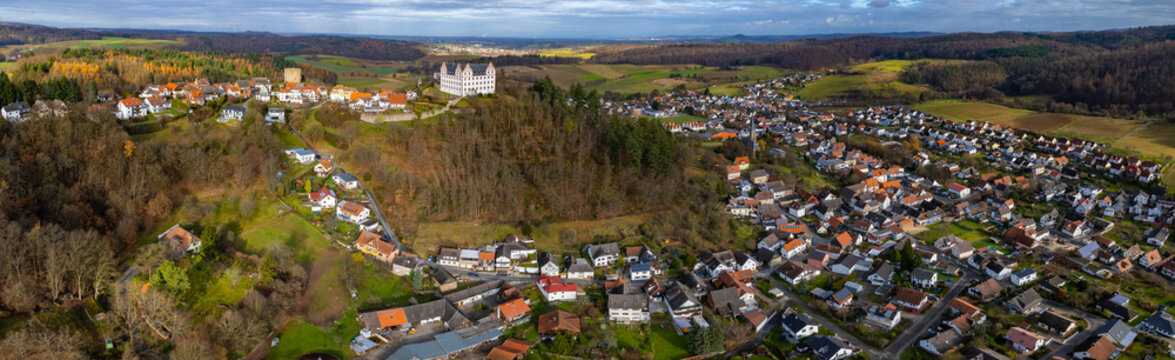  Aerial view around the city Niedernhausen, Fischbachtal in Germany. On a cloudy day in Autumn.  