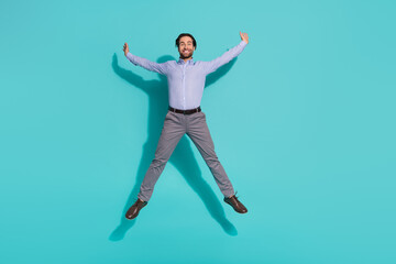 Photo of funky careless executive crazy man jump enjoy flight wear purple shirt pants shoes...