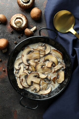 Concept of tasty food with mushroom sauce on dark textured background