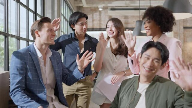 Group of diverse coworkers standing after walk through a corridor in an office, holding paper cups,professional businesspeople discussing and brainstorming together on workplace in office