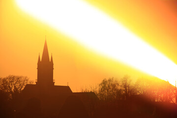 Obraz premium Sunset over church silhouette, shot with a special long exposure technique