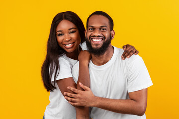 Fototapeta premium African American bearded man cuddling with his woman