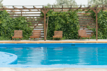 Fototapeta na wymiar Patio and blue water pool.