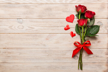 Naklejka na ściany i meble Valentine day composition with rose flower and red heart on table. Top view, flat lay, copy space Holiday concept