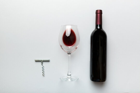 Flat Lay Composition With Corkscrew, Bottle Of Wine And Elegant Glass On Colored Table. Flat Lay, Top View Wth Copy Space