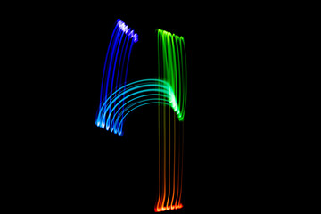 Freezelight photography. Isolated figure on a black background. Number four.