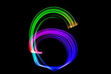Freezelight photography. Isolated figure on a black background. Number six.