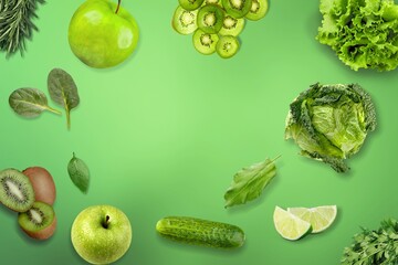 Creative kiwi, cucumber, apple, green peas on the green background. Food concept.