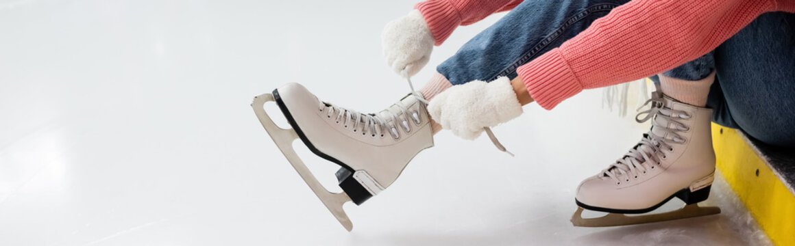 Cropped View Of Woman Tying Shoe Laces On Ice Skates, Banner.