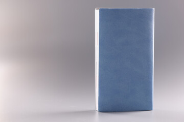 Diary with blue leather cover on gray background