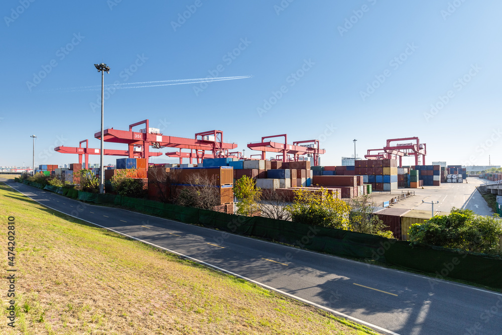 Poster inland container yard against a blue sky