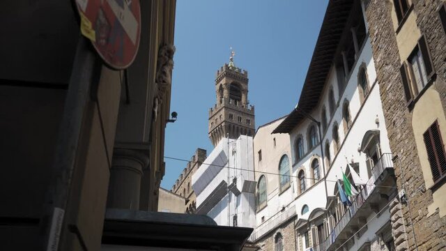 Low angle view on tenements and Palazzo Vecchio town hall Florence, Italy