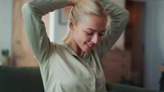 Positive blond woman makes tail at home