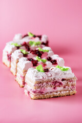 Pieces of Tasty Homemade Biscuit Cake on Pink Background Tasty Dessert with Cream Vertical