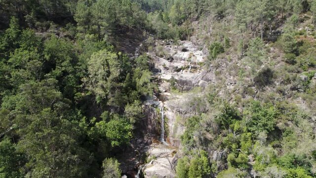 Fecha de Barjas waterfall streaming to beautiful natural pool, Peneda-Ger&ecirc;s National Park.