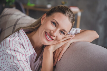 Photo of pretty mature blond lady sleep wear white shirt self-isolation at home in living room alone