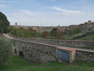 Panorama of Colle di Val d'Elsa, from the fourteenth-century arched bridge, on the medieval part of the village which stands on a hilly ridge alongside a valley