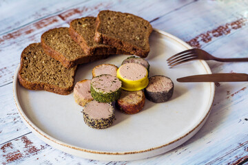 Bread and  different type pate in a plate 