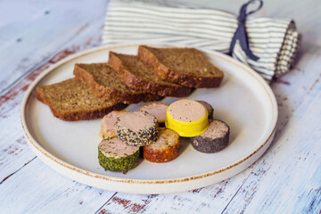 Bread and  different type pate in a plate 