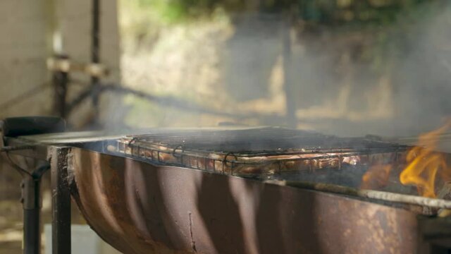 meat grilling on a barbeque in slow motion 60fps