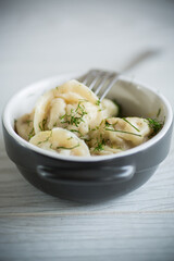 boiled dumplings with meat filling in a bowl