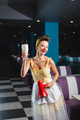 happy pin up waitress holding megaphone and milkshake.