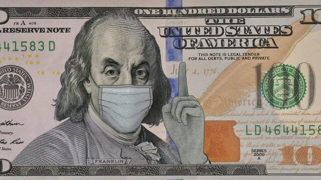 In a doctor's mask, the figure on the paper dollar bill threatens with a finger, Franklin is not happy. High-quality animation of a hundred dollar bill.
