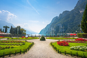 Gardens on the lake. Riva del Garda, Italy - obrazy, fototapety, plakaty