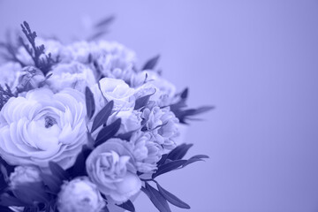 Beautiful bouquet of mixed different flowers on lilac blue background, greeting, gift. Violet background, monochrome color of the year 2022