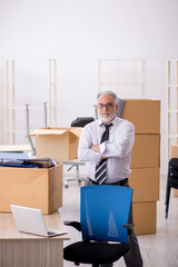 Old male employee in relocation concept