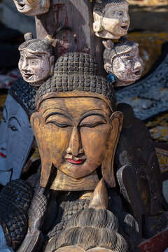 Handmade image of Buddha face in a tourist stall on market near Inle Lake in Burma. Souvenir items for sale in Myanmar