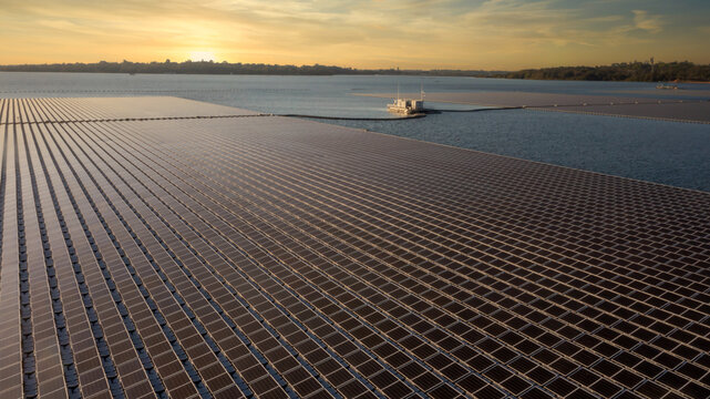 Aerial view floating solar cell power plant with solar cell generate the electric on the lake, Floating solar panels and cell platform on the water ecological energy.