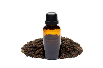 Black pepper essential oil in glass bottle with pile of peppercorn isolated on white background.