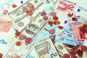 Cash on table isolated: dollars, euro, rubl broken money. All in mess, global crisis concept, dollar rules world