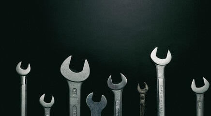 Wrenches isolated on a black background. Copy space.