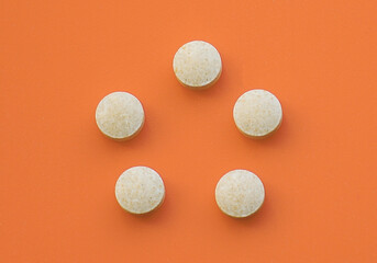 round convex tablets vitamins for maintaining health